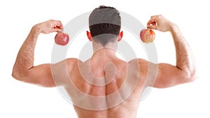 Athletic male body builder holding red apple