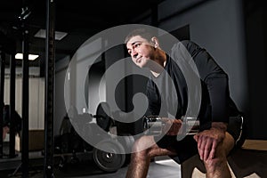 Athletic male exercising in the fitness club
