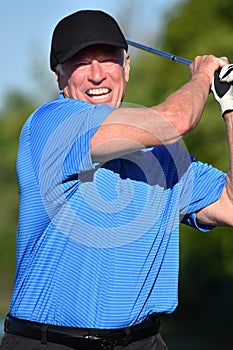 Athletic Male Golfer Working Out With Golf Club Golfing
