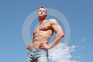 athletic male model in blue jeans