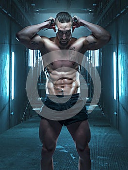 Athletic Man Bending a Twister Bar Behind his Head