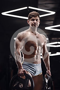 Athletic man doing bent over row muscles