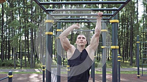 Athletic man doing exercise outdoor. Workout. Street training and physical activity