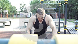 Athletic man doing exercise outdoor. Workout. Street training and physical activity