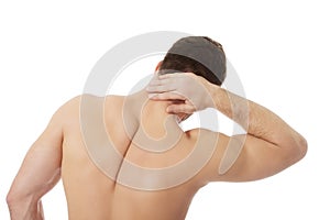 Athletic man feeling pain in his neck.