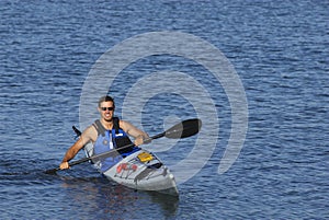 Athletic man in kayak