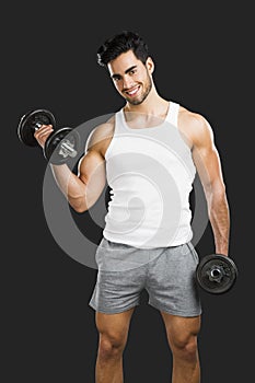 Athletic man lifting weights