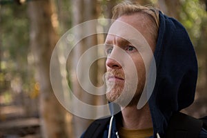 Athletic man looking at forest during daytime