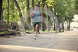 athletic man runner running in sportswear outdoor. anaerobic load