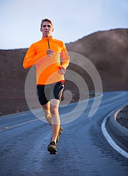 Athletic man running jogging outside