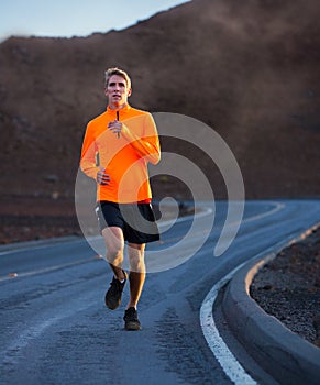 Athletic man running jogging outside