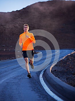 Athletic man running outside, training outdoors