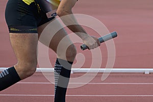Athletic man running a relays