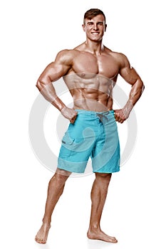 athletic man showing muscular body, isolated over white background. Strong male nacked torso abs