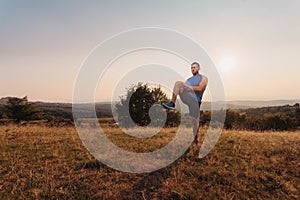 Athletic man stretching outdoor