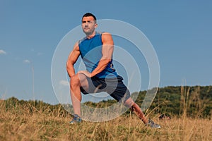 Athletic man stretching outdoor