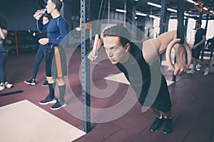 Athletic man training in modern gym