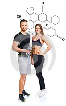 Athletic man and woman with dumbbells with the chemical formula