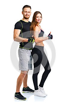 Athletic man and woman after fitness exercise with a finger up o