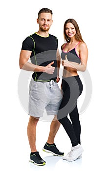 Athletic man and woman after fitness exercise with a finger up o