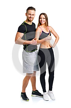 Athletic man and woman after fitness exercise with thumbs up on