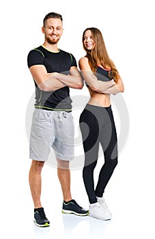 Athletic man and woman after fitness exercise on the white