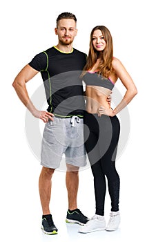 Athletic man and woman after fitness exercise on the white