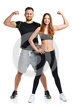 Athletic man and woman after fitness exercise on the white