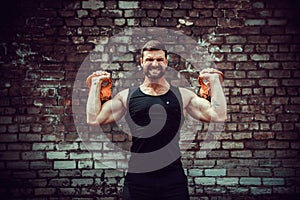 Athletic man working out with a kettlebell. Strength and motivation