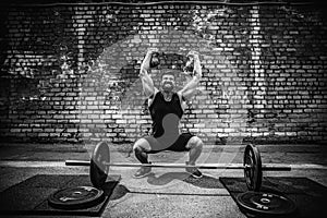 Athletic man working out with a kettlebell. Strength and motivation