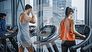 Athletic People Running on Treadmills, Doing Fitness Exercise. Athletic and Muscular Women and Men