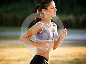 Athletic Runner Training in a park for Marathon.