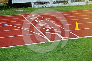 Athletic running track at start point with number on track for running race