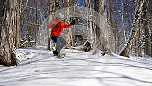 Athletic Senior on Snowshoes in Canadian Forest