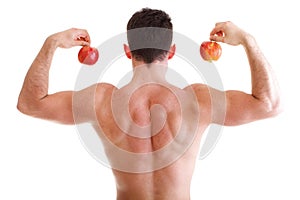 Athletic male body builder holding red apple