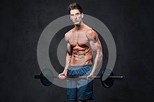 Athletic shirtless male biceps barbell workout.