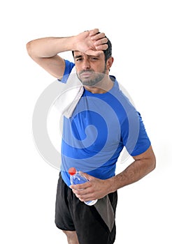 Athletic sport man holding water bottle wiping out sweat after