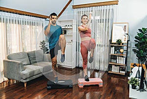 Athletic and sporty fitness couple or exercise buddy running at gaiety home.