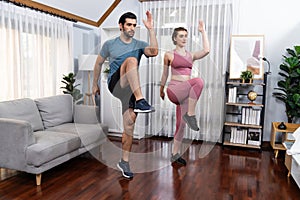 Athletic and sporty fitness couple or exercise buddy running at gaiety home.