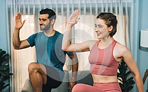 Athletic and sporty fitness couple or exercise buddy running at gaiety home.