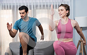 Athletic and sporty fitness couple or exercise buddy running at gaiety home.