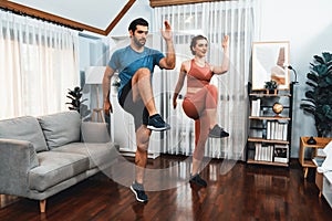 Athletic and sporty fitness couple or exercise buddy running at gaiety home.