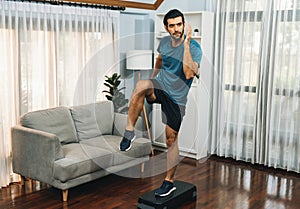 Athletic and sporty man running posture exercise at gaiety home.