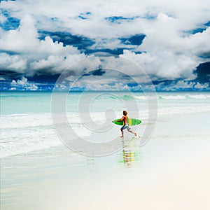 Athletic surfer with board