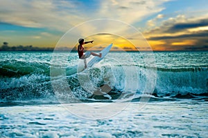 Athletic surfer with board photo