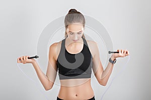 Athletic woman holding a rope