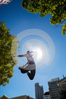 Athletic woman jumping in the air