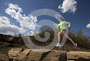 Athletic Woman Jumping While Running