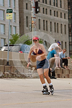 Athletic Woman Rollerblades On Urban Street