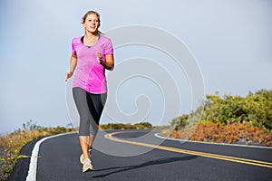 Athletic woman running jogging outside